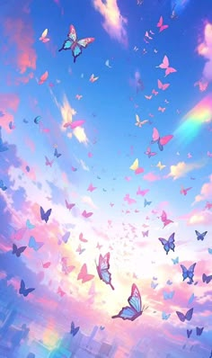 there are many colorful butterflies flying in the sky above some buildings at sunset or sunrise