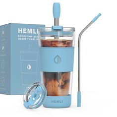 a blue blender sitting next to a box with a straw in it's mouth