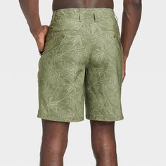 Move from the land to the sea in botanical style with these Leaf Print Hybrid Swim Shorts from Goodfellow & Co™. These hybrid swim shorts made from 4-way stretch, wrinkle-resistant fabric offer comfortable wear in or out of water. A fly button and zipper along with belt loops offers a secure fit, while the side and back pockets come in handy for stashing small essentials. Plus, the UPF 50+ rated material helps keep you protected from the sun. Pair them with your regular tees and sneakers for a c Summer Outdoor Bermuda Bottoms, Bermuda Bottoms For Outdoor Summer Activities, Bermuda Bottoms For Summer Outdoor Activities, Bermuda Bottoms For Summer Outdoor, Fitted Tropical Shorts For Beach Season, Hawaiian Style Bottoms With Built-in Shorts For Vacation, Green Hawaiian Summer Bottoms, Summer Bermuda Shorts For Outdoor, Fitted Tropical Style Shorts