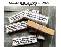 four wooden matchesticks with bible verses on them sitting on top of each other