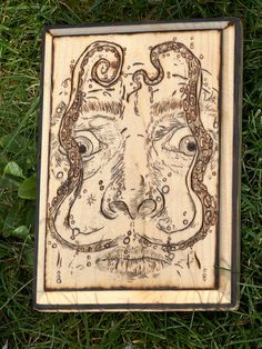 "Surreal Whiskers: Tentacular Mirage," This rectangular shaped art piece is handmade on natural wood via pyrography.  This piece merges the iconic Salvador Dali mustache with an unexpected twist, replacing its conventional form with a mesmerizing array of tentacles. Each tentacle dances across the wooden canvas with whimsical fluidity, evoking Dali's fascination with the surreal and the subconscious. "Tentacular Mirage" invites viewers to explore the boundaries between reality and illusion, offe Dali Mustache, Wood Artwork Trippy, Trippy Artwork, Wooden Canvas, Moustaches, Salvador Dali, Dali, Pyrography, Boundaries