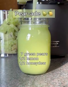 a jar filled with lemonade sitting on top of a counter