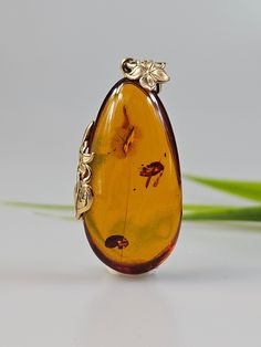 Brown cognac colour amber pendant. Perfect stunning teardrop shape pendant. Gold plated pendant (with stamping hallmark). High quality.  Very beautifull medium size cabochon. Weight:  6.88gr. total length 5×2 cm. This item was made of natural Baltic Amber. All the amber used in my jewelry is collected in my home country Lithuania.  I sell only genuine, authentic, real, natural Baltic Amber. Item may have natural imperfections. I ship within 1-2 business days. Pear-shaped Orange Jewelry Gift, Orange Pear-shaped Jewelry For Gifts, Amber Pear-shaped Jewelry Gift, Amber Pendant, Pendant Gold, Baltic Amber, Natural Stone, Natural Stones, My Jewellery