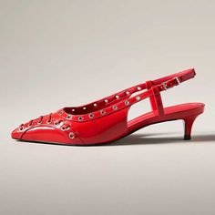 Elevate your style with these red patent leather slingback kitten heel pumps. Adorned with grommets, the shoes feature a chic pointed-toe design that exudes sophistication and trendy elegance. Color: Red Material: Patent leather Heel Type: Kitten heel Heel Height: 2'' / 50 mm approx Product measurements were taken using size 8. Please note that measurements may vary by size. Toe: Pointed toe Grommet detailed design Adjustable buckled slingback design Handcrafted US sizing. Fits true to size. Summer Pointed Toe Patent Leather Kitten Heels, Summer Slingback Patent Leather Kitten Heels, Red Patent Leather Slingback Pumps Low Heel, Luxury 4-inch Patent Leather Kitten Heels, Red Slingback Pumps With Ankle Strap And 4-inch Heel, Elegant Red Slingback Pumps With 4-inch Heel, Luxury Red-sole Kitten Heels, Red Kitten Heels With 4-inch Heel, Cowboy Shoes