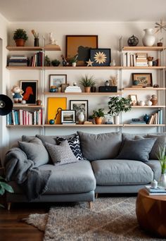 Grey Couch Living Room Gray Couch Family Room, Decorate Grey Couch, Apartment Decorating Grey Couch, Silver Couch Living Room, Grey Sectional Living Room, Shelves Over Couch, Floating Shelves Above Couch, Living Room Grey Couch