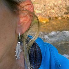 For all our fishing friends, this one is for you ! Fishin' Trout Earrings. These unique earrings feature a etched design of trout with some of their spots. We start with raw brass and etch the spots and texture into the trout. we then finish in one of two finishes: Matte Silver and Antique Brass. Click here to learn more about our process. Show off your love for fishing and the river. Fishing Trout Earrings Detail Trout Size 1.5" long Drop length: just over 2.0" Matte silver or antique brass Han Fly Fishing Jewelry, Trout Earrings, Fly Earrings, Fishing Lure Earrings, Fishing Trout, Silver Fish-shaped Sterling Silver Earrings, Nickel-free Silver Fish-shaped Earrings, River Fishing, Cuff Rings