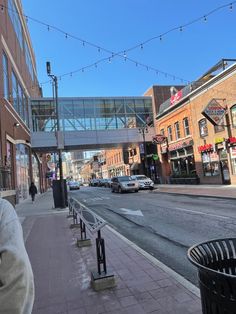 a city street with cars parked on both sides