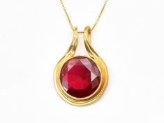 Gold Ruby Pendant set with a Created Ruby in a flawless diamond cut & bright red color, at 18mm (20 Carats).  Gold Vermeil: 18k Gold over Solid 925 Sterling Silver ☞ made to last. Matching Ring & Earrings - please ask me Details : ♥ Each item comes in a cute GIFT BOX ✓ ♥ GUARANTEE on all materials ✓ ♥ 18k Gold over Solid 925 Sterling Silver ✓ ♥ Each stone set professionally - WellMade Craftmanship ♕ ♥ More Beautiful jewellery on www.etsy.com/shop/AdinaStone ☜ ✉ Shipping by Royal Mail ✉ Tracked S Flawless Diamond, Ruby Pendant, Cute Gift Boxes, Red Necklace, Matching Rings, Round Pendant, Pendant Set, Solid 925 Sterling Silver, Ring Earrings