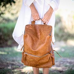 This stunning backpack is made of genuine soft nappa leather in a Honey Brown color. With enough room for all your daily essentials, It is perfect for everyday use, as well as for laptops of all sizes, IPAD, A4 files, books and travel. it as a unique structured with a zipper closure at the top, and three outside zipper pockets for mobile, keys, etc. It is fully lined with black strong cotton fabric which I divide to two large interior, zip pocket, and a leather cell phone pocket, shoulder strap Honey Brown Color, Leather Backpack Women, Leather Bag Handmade, Women Backpack Travel, Brown Leather Backpack, Women Leather Backpack, Backpack Women, Brown Leather Bag, Women Travel