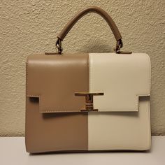 New Condition - New With Tags Trina Turk Taupe & Off White Satchel With Open Compartment With Two Front Pockets And Back Zippered Pocket, Removable Strap Measurements Are Approximate Height: 9" Width: 10" Depth At Base: 3¼" Strap Length: 9" Shell 100% Genuine Leather Lining 100% Polyester Made In China Wipe With Damp Cloth ____________________________________ Trina Turk - Purse - Satchel - Handbag - Classic - Chic - Genuine Leather Elegant Tan Shoulder Bag For Spring, Elegant Tan Bag For Spring, Elegant Tan Spring Bag, White Formal Shoulder Bag For Spring, Formal White Shoulder Bag For Spring, Classic Chic, Satchel Handbags, Trina Turk, Satchel