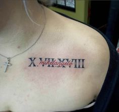 a woman with a cross tattoo on her chest that says x, y, and w