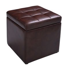 a brown leather ottoman sitting on top of a white floor