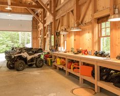 the inside of a building with several atvs in it