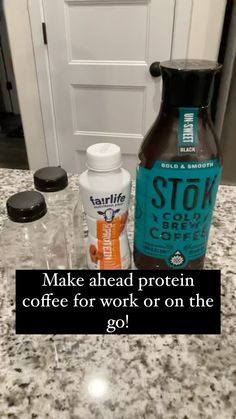 two bottles of coffee sitting on top of a counter next to an open door with the words make ahead protein coffee for work or on the go