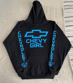 Chevy Sky Blue Logo Women Hoodie, just in time for the winter. Brand is Gildan, Handmade 8.0 oz., 50/50 cotton/polyester Reduced pilling and softer air-jet spun yarn Double-lined hood with color-matched drawcord 1x1 athletic rib knit cuffs and waistband with spandex Front pouch pocket Double needle stitching at waistband and cuffs Quarter-turned Tearaway label    And every Hoodie is made to order. Many different colors upon request Make sure to message me with the color you want. Shooting Range Outfit Woman, Western Hoodies, Sky Blu, Sweatshirt Ideas, Chevy Girl, Logo Women