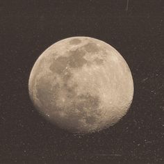 an old photo of the moon in black and white