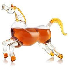 a glass horse figurine is shown on a white background