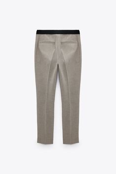 Mid-Rise Tapered Pants With Back Elastic Waistband. Front Pockets And Back False Welt Pockets. Side Vents At Hem. Front Zip And Metal Hook Closure. Workwear Bottoms With Elastic Waistband And Tapered Legs, Zara Workwear Pants With Side Pockets, Zara Stretch Tapered Leg Pants, High-waisted Pants With Elastic Side Panels, Zara Stretch Bottoms For Work, Office Straight Pants With Pull-on Style, Office Pull-on Straight Pants, Pull-on Straight Pants For Office, Fall Ankle-length Pants With Elastic Side Panels