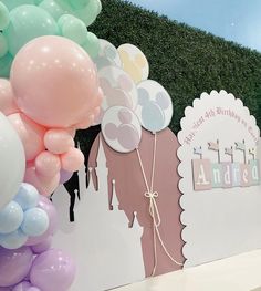 there are many balloons on the wall