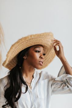 Wild and free, my fringe ruffles in the wind while protecting you from our friend, the sun. My detailing is soft, yet structured. I am one-of-a-kind. Why We Love ItMade of soft handwoven raffia. Perfect for those summer days where you are basking in the golden light and need a soft, breatheable beachy hat. Affirmation: I am one-of-a-kind Size + FitHeight: 11.5 cm/ 4.5 inches Brim: 10 cm/ 4 inches Adjustable sweatband to fit a range of sizes. Bohemian Fedora Straw Hat For Warm Weather, Beige Bohemian Panama Hat For Warm Weather, Bohemian Beige Panama Hat For Warm Weather, Bohemian Straw Hat For Warm Weather, Bohemian Brimmed Straw Hat For Warm Weather, Bohemian Straw Hat With Short Brim For Warm Weather, Bohemian Straw Panama Hat For Warm Weather, Bohemian Woven Straw Hat For Warm Weather, Bohemian Wide Brim Panama Hat For Warm Weather