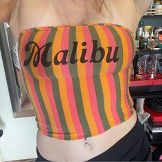 Womens Size Small / Medium Malibu Tube Top With Flattering Vertical Stripes. Comes All The Way Down To The Belly Button, Is Double Lined. Never Worn. It Has A Worn Look But It Was Purchased That Way New. No Stains Tears Or Rips. Multicolor Fitted Top With Letter Print, Fitted Multicolor Top With Letter Print, Fitted Multicolor Tops With Letter Print, Y2k Multicolor Beach Tops, Y2k Pink Top For Beach, Pink Y2k Style Beach Top, Fun Fitted Beach Top, Summer Fitted Tops With Letter Print, Fitted Letter Print Summer Tops