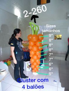 a woman standing next to a giant carrot on top of a white tiled floor in front of a wall