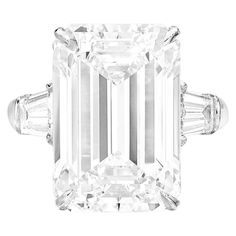 This stunning GIA certified ring showcases a 10.06-carat emerald cut diamond, set in luxurious platinum for a timeless, elegant look. With an F color grade, the diamond displays a near-colorless brilliance, while its VS1 clarity ensures only minor inclusions that are invisible to the naked eye. The diamond's excellent polish and symmetry reflect its superior craftsmanship, maximizing its radiant sparkle. Complemented by tapered baguette diamonds on either side, the ring offers a balanced and ref Emerald Cut Diamond Engagement Ring, Emerald Cut Diamond Engagement, Contemporary Engagement Rings, Emerald Cut Diamond Ring, Beautiful Diamond Rings, Platinum Diamond Rings, Modern Engagement Rings, Contemporary Ring, Engagement Rings Platinum