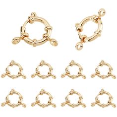 six pairs of gold plated metal nose rings with chains on each side and four different sizes