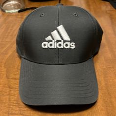 Never Worn Black Adjustable Hats For Golf, Adjustable Black Golf Hat, Adjustable Black Hat For Golf, Black Baseball Cap For Baseball Season, Classic Black Baseball Cap For Sports, Black Cap For Golf, Casual Black Hat With Adidas Logo, Casual Black Adidas Logo Hat, Black Casual Adidas Hat