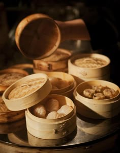 there are many wooden bowls with food in them