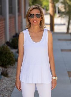 Take a look at our White Tank Top Made out of a super soft bamboo yarn knit jersey fabric Bamboo is similar to rayon Fabric content: 95% bamboo, 5% spandex Color: White Loose body with sides and front shorter than the back Straps are wide enough to wear a bra Round neck in front and back 1/2" band finish around the neck and armholes Center back length from top to bottom 22" Bamboo Tank, Bamboo Yarn, Just Style, Rayon Fabric, White Tank Top, White Tank, Knitting Yarn, Jersey Fabric, Knit Jersey