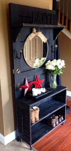 a black cabinet with flowers and star decorations