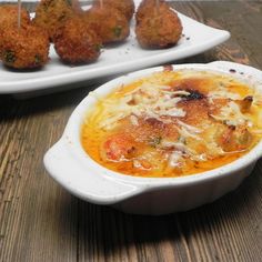 some food is in a white bowl on a table