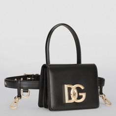 This Dolce & Gabbana Black Leather Mini Belt Bag Handbag Is Brand New With Tags. Hailing From Dolce & Gabbana's 3.5 Collection, This Belt Bag Is A Versatile And Sophisticated Choice For The Modern Woman. It's Crafted From Supple Leather And Detailed With The Brand's Crossover Logo In Gold-Tone Hardware, Complete With An Elegant Bejewelled Chain. Material: 100% Leather Color: Black With Gold Metal Detailing Strap: One Top Handle, Waist Strap Black Inner Lining Flap Closure Logo Details, Logo Engr Designer Evening Bag With Adjustable Strap, Formal Crossbody Bag With Logo Hardware, Luxury Belt Bag With Removable Shoulder Pouch, Luxury Belt Bag With Adjustable Strap, Top Handle Belt Bag With Detachable Strap, Luxury Black Belt Bag For Evening, Luxury Black Belt Bag With Removable Pouch, Luxury Black Pouch Belt Bag, Designer Black Bags With Logo Hardware