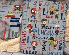 the blanket has many different avengers characters on it