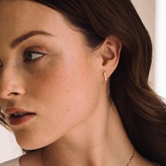 Minimal in design, but feminine in material, the Mother of Pearl Zoe earrings are sure to be a regular in your rotation. Available in 14k gold plated brass Size: 7/16" 9.5mm x 1.5mm Mother of Pearl inlay Stainless steel post with friction back SKU: BYE1091 Classic Gold Plated Cartilage Earrings As Gift, Tiny Modern Gold Earrings, Elegant Tiny 14k Gold Huggie Earrings, Classic Tarnish Resistant Cartilage Earrings As Gift, Delicate Gold-plated Huggie Earrings For Everyday, Minimalist 14k Gold Hypoallergenic Earrings, Minimalist Gold Plated Drop Huggie Earrings, Modern Tiny Earrings For Everyday, Tiny Yellow Gold Elegant Huggie Earrings