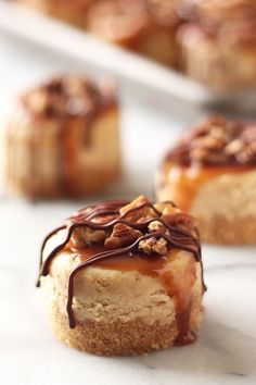 some kind of dessert that is sitting on a table with other pastries in the background