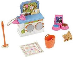 a toy kitchen set with accessories including a stove, sink, and utensils