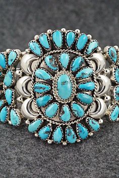 This stunning turquoise and sterling silver bracelet was made by Navajo silversmith Eunise Wilson. The back is signed EJW and stamped sterling.Size: 5 3/4" (will fit up to a 6 5/8" wrist)Gap: 7/8"Width: 2 1/8"Free shipping on all orders! We ship with USPS and always include tracking. All orders ship within a day of payment.Returns are accepted up to 30 days after you receive your order. Just send us a message. Our shop offers cash back or store credit. The item must be returned in new condition. Southwestern Style Sterling Silver Bracelet, Turquoise Bracelets, Sterling Silver Bracelet, Holiday Sales, Turquoise Sterling Silver, Sterling Silver Bracelets, Turquoise Bracelet, Silver Bracelet, Gap