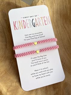 the first day of kindergartaten bracelets are pink with gold hearts