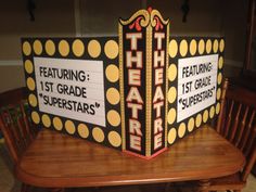 the theatre sign has been made to look like it is being displayed on a table