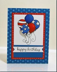 a happy birthday card with balloons and stars on the front, sitting on a table