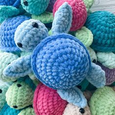 a pile of crocheted stuffed animals sitting on top of each other