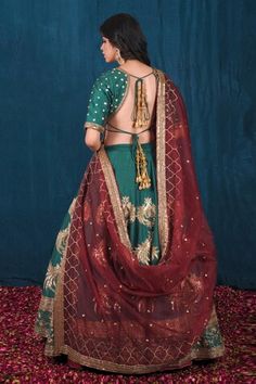 Green attached cancan lehenga adorned with beautiful dabka, nakshi, moti, zari, sequin and cutdana work. Paired with  embroidered padded blouse. Comes with maroon dupatta adorns with zari, sequin cheeta and moti work and green veil dupatta. - Aza Fashions Designer Art Silk Sharara With Tilla Details, Art Silk Dupatta With Tilla For Reception, Reception Art Silk Dupatta With Tilla Detail, Designer Chanderi Dupatta With Tilla, Festive Reception Sets With Tilla Details, Designer Chanderi Lehenga With Tilla Embroidery, Traditional Sharara With Tilla For Designer Wear, Designer Wear Transitional Dupatta With Tilla, Designer Bollywood Choli With Tilla Detailing