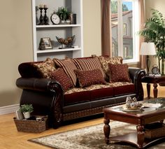 a living room with two couches and a coffee table in front of a window