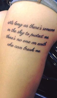 a woman with a tattoo on her thigh saying, as long as there's someone in the sky to protect me