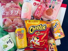 an assortment of japanese snacks including peaches, yogurt and gummy bears