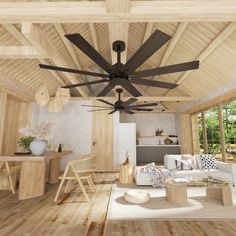 a living room filled with furniture and a wooden ceiling fan mounted to the side of a wall