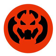 an orange and black circle with a scary face in the center