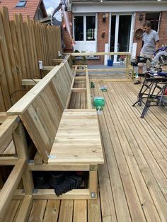 a wooden deck with benches built into it